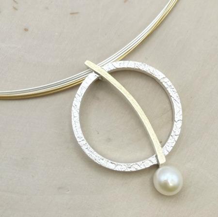 Sterling silver and 18 karat gold vermeil freshwater cultured pearl circle necklace. $585.00