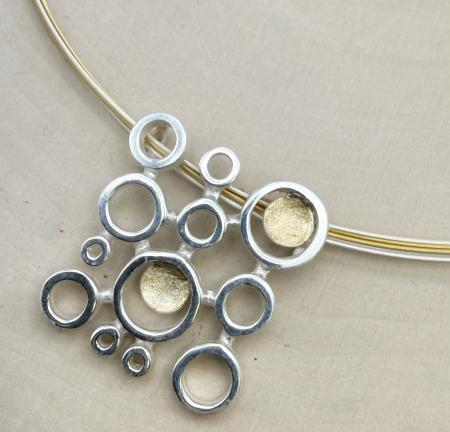Sterling silver and 18 karat gold vermeil square circles necklace. $700.00