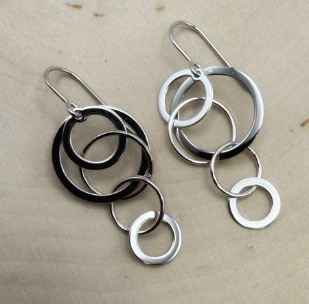 Sterling silver cascading circles dangle earrings. $124.00