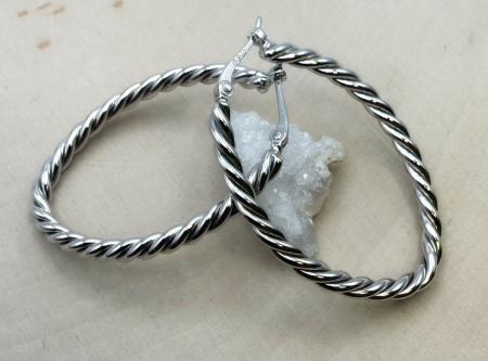 Sterling silver twisted oval hoops. $134.00
