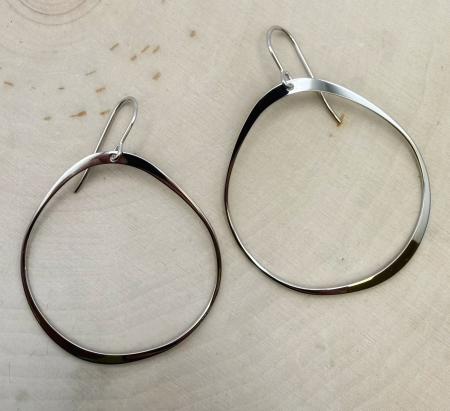 Sterling silver abstract circle earrings. $89.00