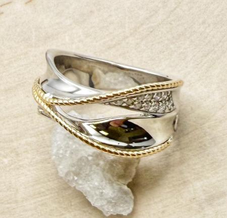 Sterling silver and 18 karat yellow gold diamond ring. $900.00