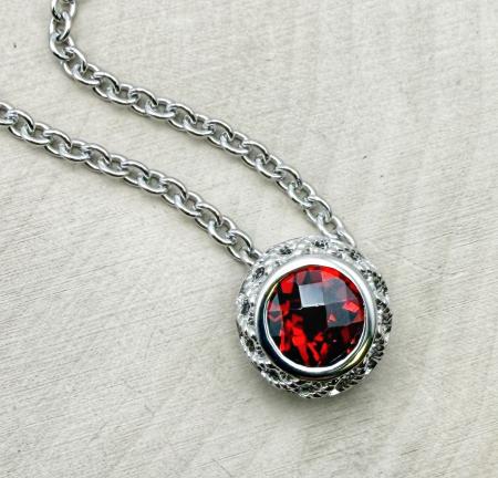 Sterling silver and checkerboard cut round garnet necklace. $350.00
