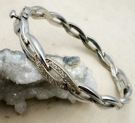Sterling silver, 18 karat gold accent and diamond bangle bracelet. $775.00