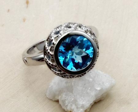 Sterling silver and round checkerboard cut Swiss blue topaz ring. $150.00