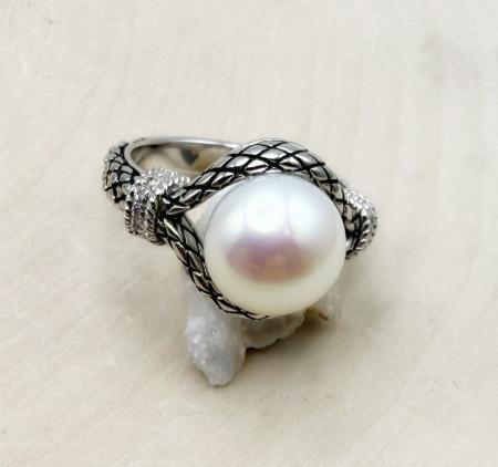 Sterling silver, 10.5mm freshwater button pearl and diamond ring. $225.00