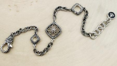 Sterling silver and filigree link bracelet. $150.00