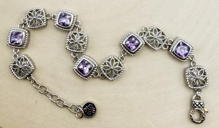 Sterling silver filigree link and checkerboard cushion cut amethyst bracelet. $700.00