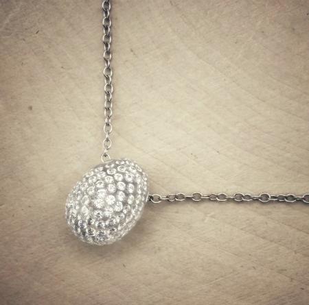 The Solare diamond egg. Diamonds set in clear carbon composite. $4500.00