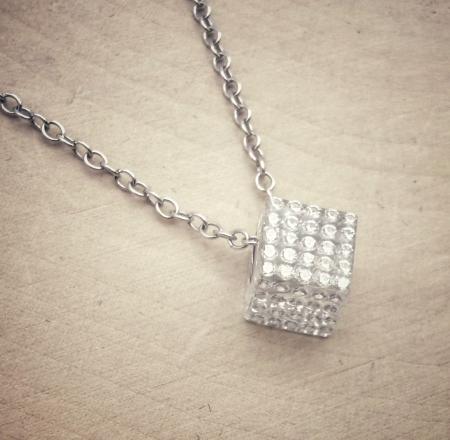 The Solare diamond cube. Diamonds set in clear carbon composite. $2130.00