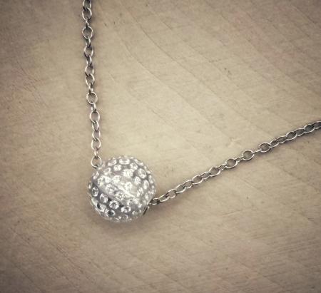 The Solare diamond ball. Diamonds set in clear carbon composite. $2415.00