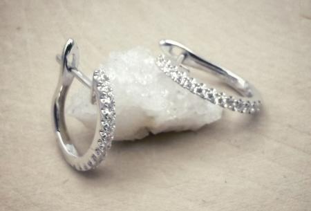 14 karat white gold small diamond hoop earrings. $1530.00