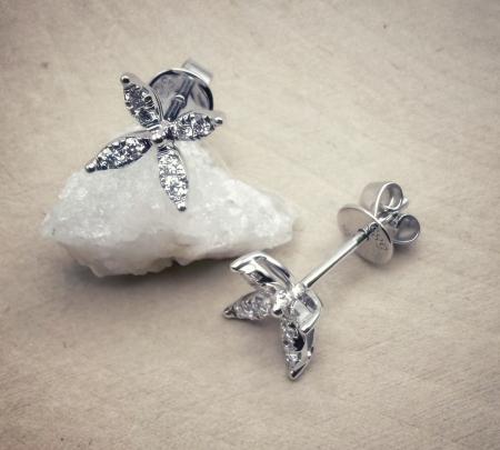 14 karat white gold flower design diamond stud earrings. $1410.00