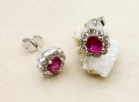14 karat white gold ruby and diamond halo earrings. $3375.00