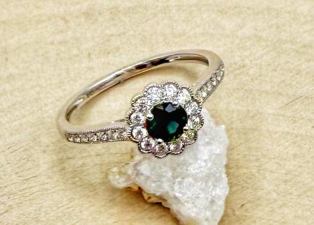 14 karat white gold sapphire and diamond halo ring. $2170.00