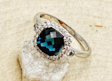 14 karat white gold cushion checkerboard cut London blue topaz and diamond ring. $1475.00