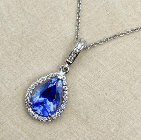 14 karat white gold pear shape tanzanite and diamond necklace. $3815.00