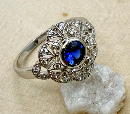 14 karat white gold sapphire and diamond filigree ring. $2395.00