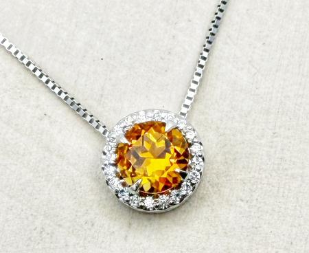 14 karat white gold citrine and diamond halo necklace. $1275.00